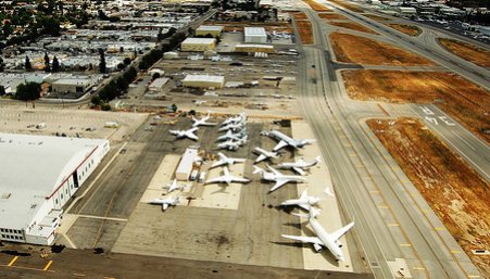 Airplanes lined up at runway at Van Nuys Airport