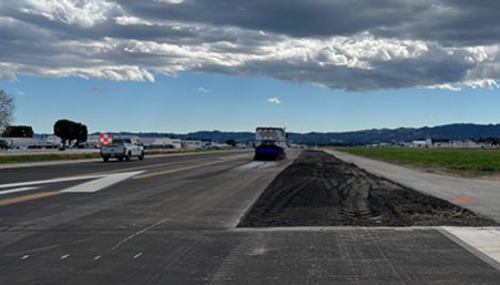 Workers paving a runway at van Nuys airport